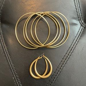 Smooth gold earrings and bangles